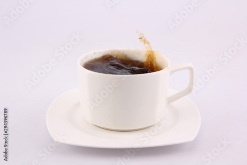 coffee splash from a cup isolated on white background.