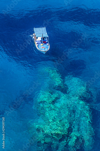 Floating boat in the middle of the sea.