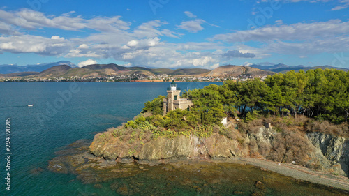 Aerial drone photo of iconic lighthouse built in small islet in famous city of Halkida or Chalkida with clear water seascape and beautiful sky - clouds, Evia island, Greece © aerial-drone