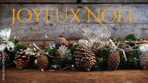 Joyeux NoÃ«l written over Christmas decorations photo