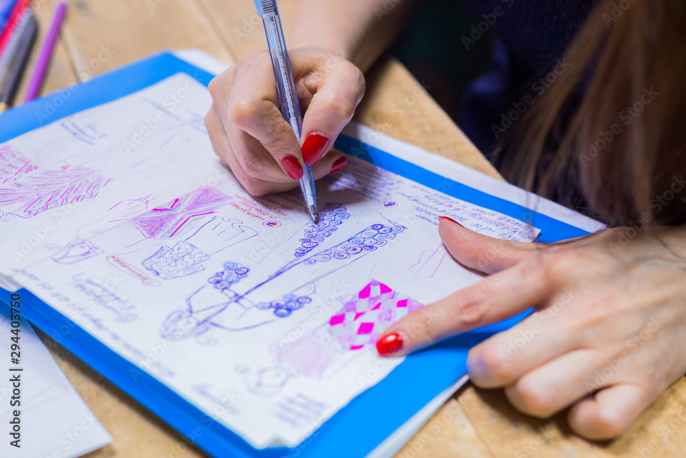 Fashion designer drawing design sketch