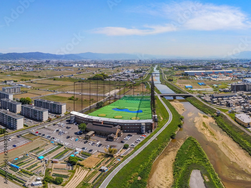 Aerial view over huge golf driving range