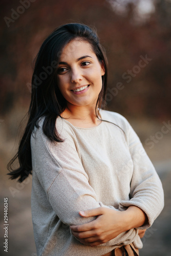 Portrait of beautiful charming smiling woman. Autumn time