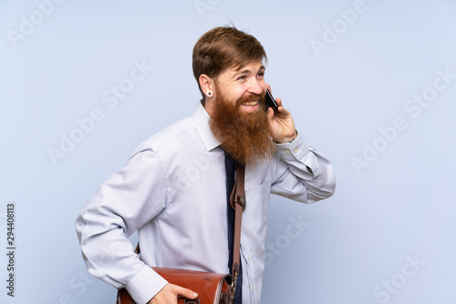 Businessman with long beard talking to mobile over isolated background