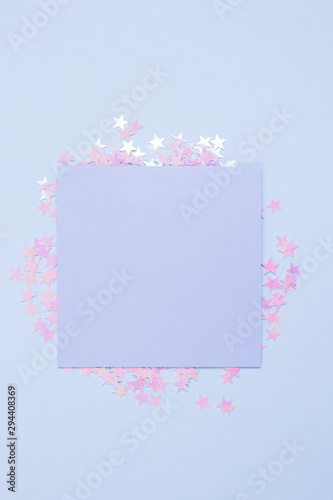 Festive concept. Pastel blue cards mockup and blue background with scattered glitter stars. Space for your text. Gbar style.