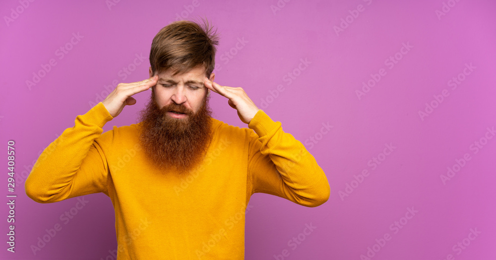Redhead man with long beard over isolated purple background with headache Redhead man with long beard over isolated purple background with headache