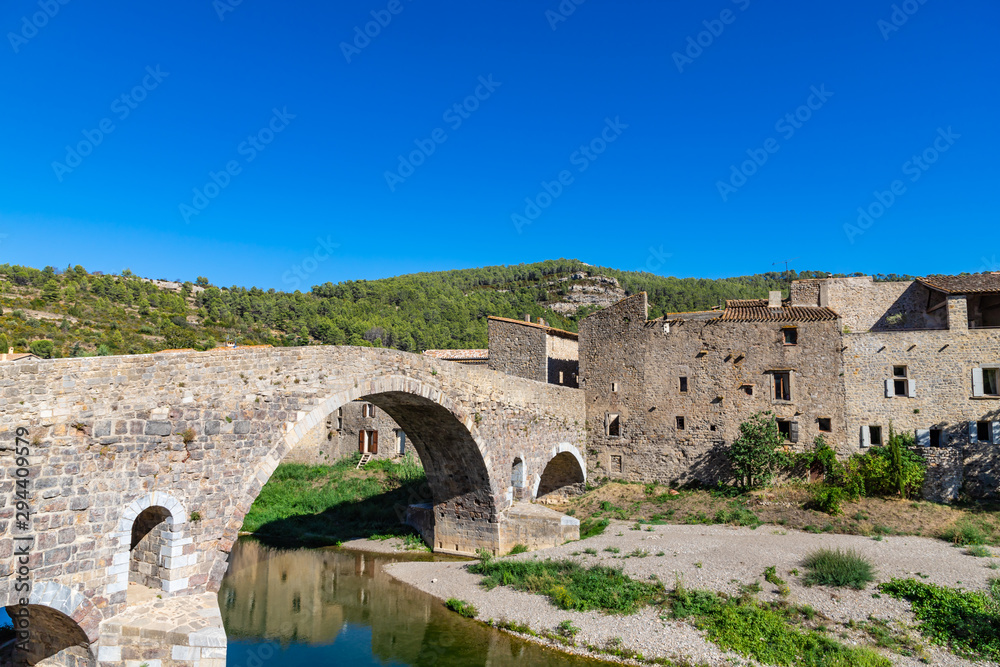 Medieval vaulted arch bridge over Orbieu river in Lagrasse, France