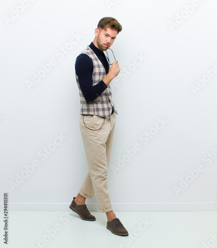 young man full body posing against white background photo