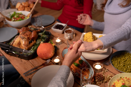 Millennial adult friends celebrating Thanksgiving together at home 