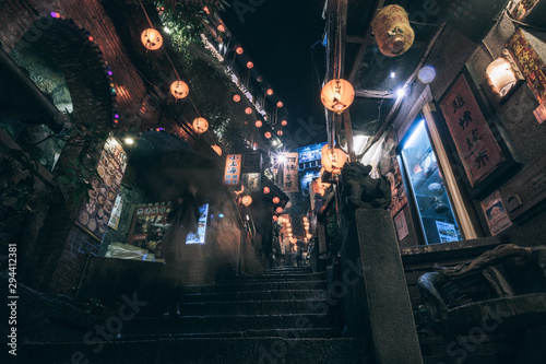 A Mei Tea House located in the narrow alleys with road sign and chinese red lantern at old street, the famous tourist spot in Jiufen