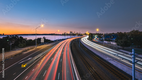 Traffic on city road during sunset in Perth, WA Australia