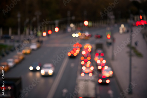 Blured cars and traffic lights in evening city