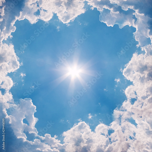 Blue Sky With White Clouds And Sun. The Natural  Background