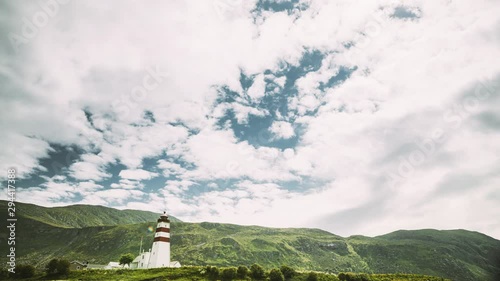 Alnesgard, Godoya, Norway. Old Alnes Lighthouse In Summer Day In Godoy Island Near Alesund Town. Alnes Fyr photo