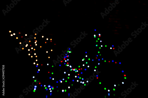 Bicycle of lights with pine tree on black background