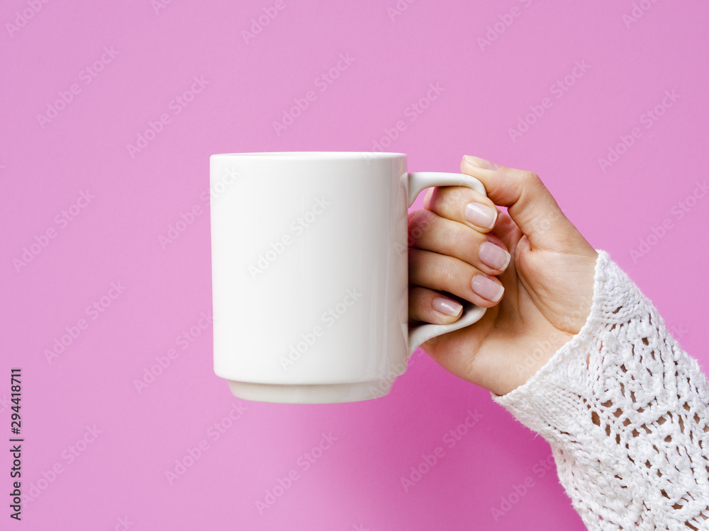 Close-up woman with mug and pink background