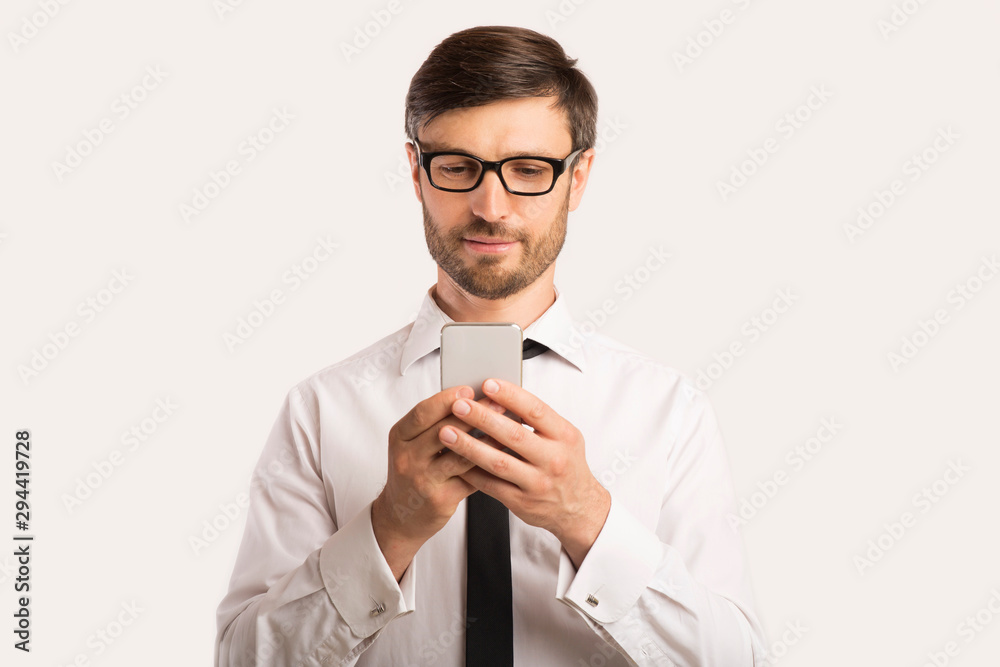 Businessman Using Smartphone Standing Over White Background Businessman Using Smartphone Standing Over White Background