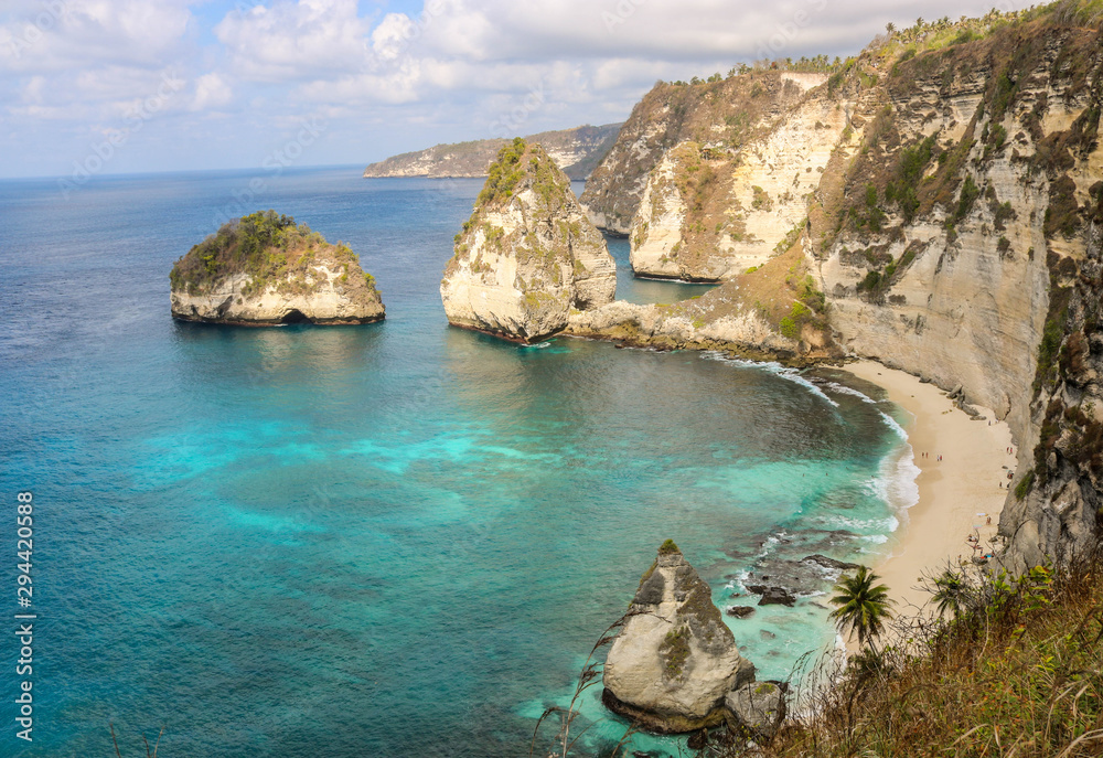 Panorama view of diamond beach in Nusa Penida Island. Bali, Indonesia. Landscape view of diamond beach with rocky and turquoise sea. diamond beach is tourist attraction. Travel concept Panorama view of diamond beach in Nusa Penida Island. Bali, Indonesia. Landscape view of diamond beach with rocky and turquoise sea. diamond beach is tourist attraction. Travel concept