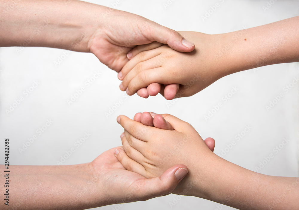 Hands holding eachother with care. Family connection. Social concept. Hands holding eachother with care. Family connection. Social concept.