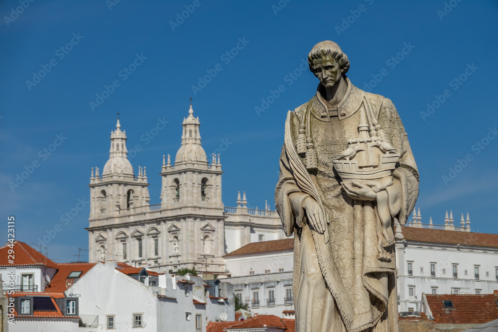 Sculpture of Sao Vicente St. Vincent of Saragossa, with Igreja de Sao Vicente de Fora in the Background. Lisbon. Portugal