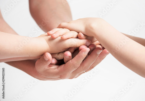 Hands holding eachother with care. Family connection. Social concept.