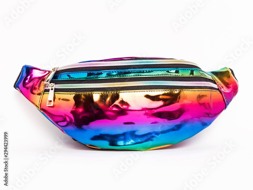 Multicolored trendy waist bag for girls on a white background. Belt bag has a metallic sheen and two zippers.
