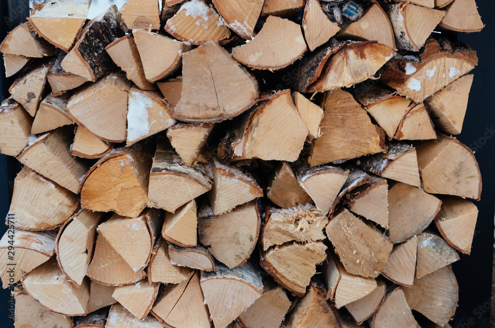 Stacks of Firewood. Preparation of firewood for the winter. Pile of Firewood. Wooden background. Alternative heating Stacks of Firewood. Preparation of firewood for the winter. Pile of Firewood. Wooden background. Alternative heating