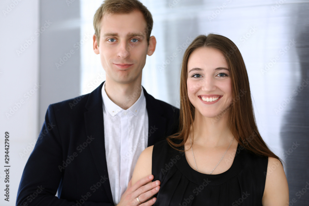 Businessman standing and looking at camera in office. Headshot of casual dressed guy Businessman standing and looking at camera in office. Headshot of casual dressed guy
