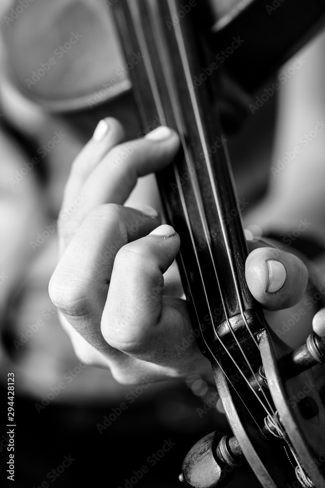 Girls Hand Playing Fiddle Closeup right on fiddle's neck Girls Hand Playing Fiddle Closeup right on fiddle's neck