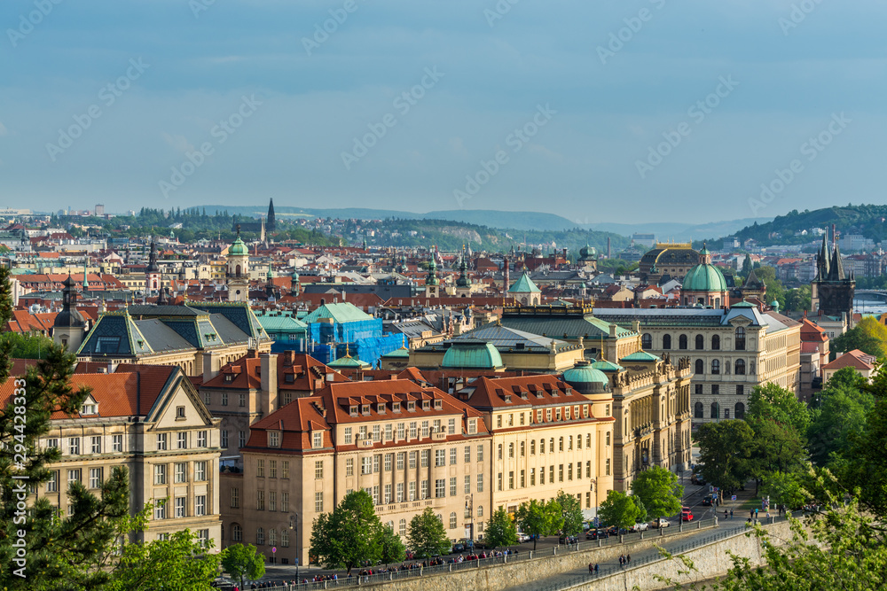 Aerial view of citycape of old town of Prague, with a lot of  rooftops, churches, and the landmarks. view from the Letna park.