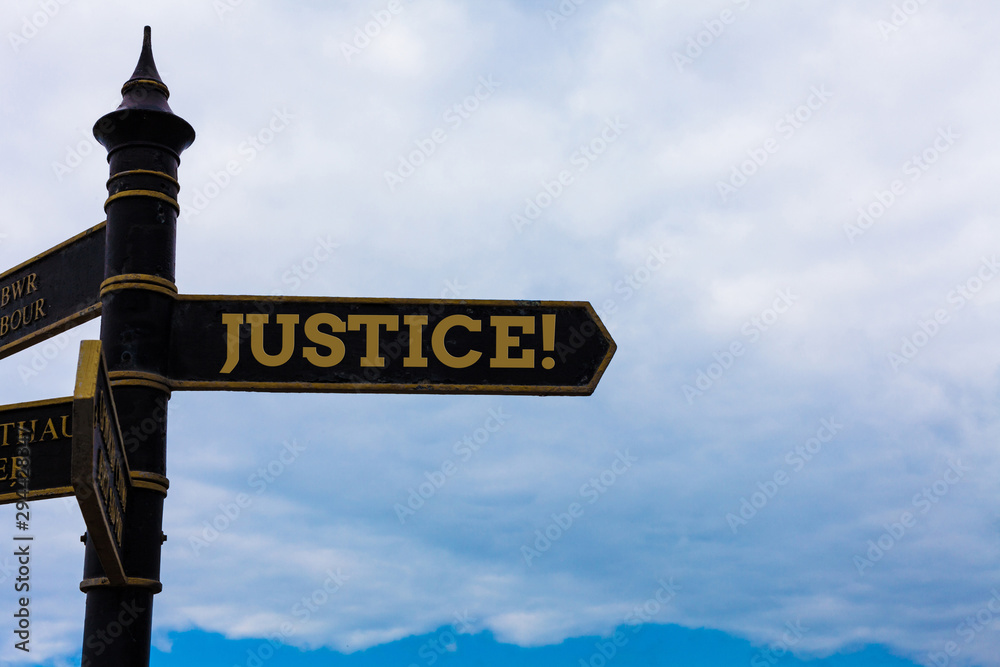 Conceptual hand writing showing Justice. Concept meaning impartial adjustment of conflicting claims or assignments Road sign on the crossroads with blue cloudy sky in the background Conceptual hand writing showing Justice. Concept meaning impartial adjustment of conflicting claims or assignments Road sign on the crossroads with blue cloudy sky in the background