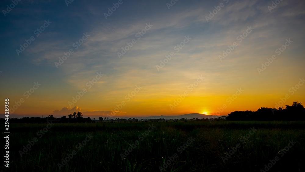 Clouds and colorful blue sky evening , mountain and tree with sunset light.Nature background Clouds and colorful blue sky evening , mountain and tree with sunset light.Nature background