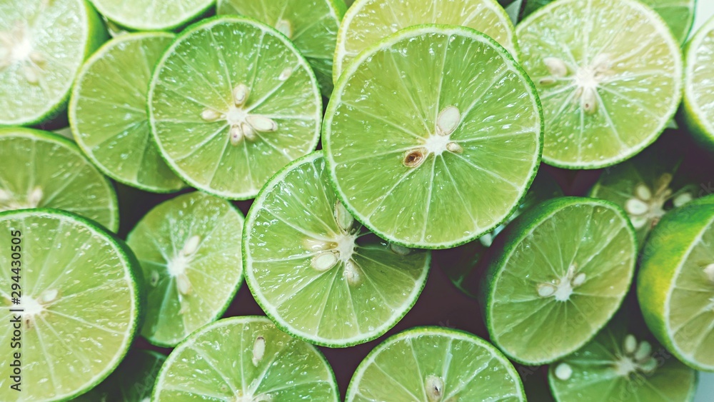 Lime Background. Close up shot of limes. Selective Focus of sliced lime. Lime Background. Close up shot of limes. Selective Focus of sliced lime.