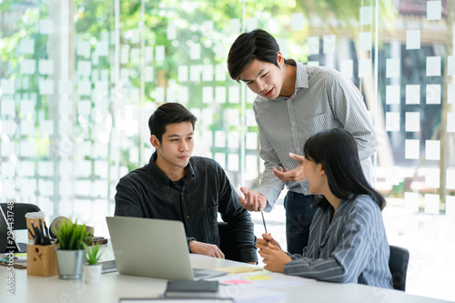 Young business team discussing together in conference room during meeting at office. Teamwork and power successful meeting workplace concept.