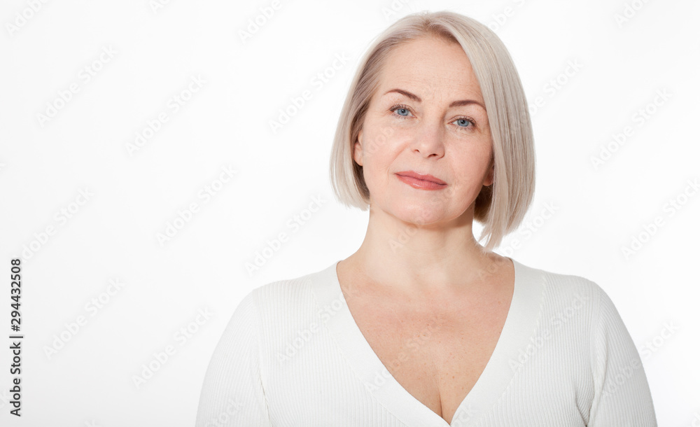 Happy woman emotionally posing in a studio. Happy woman in yellow bright sweater on white background Happy woman emotionally posing in a studio. Happy woman in yellow bright sweater on white background