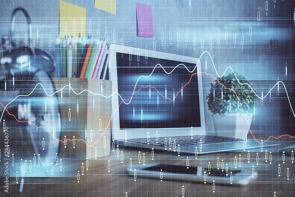 Financial graph colorful drawing and table with computer on background. Double exposure. Concept of international markets. Financial graph colorful drawing and table with computer on background. Double exposure. Concept of international markets.