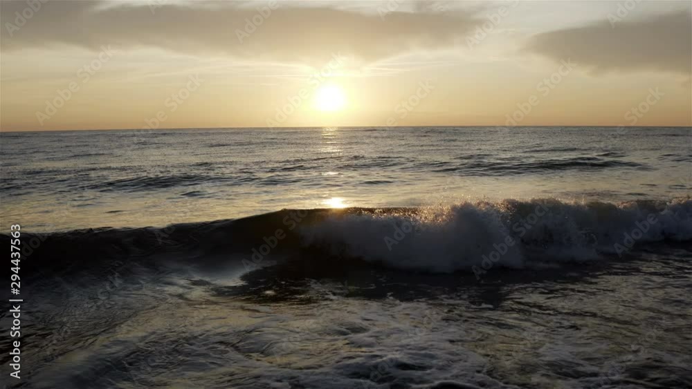 sea waves are washed ashore in the sunset. sea waves are washed ashore in the sunset.