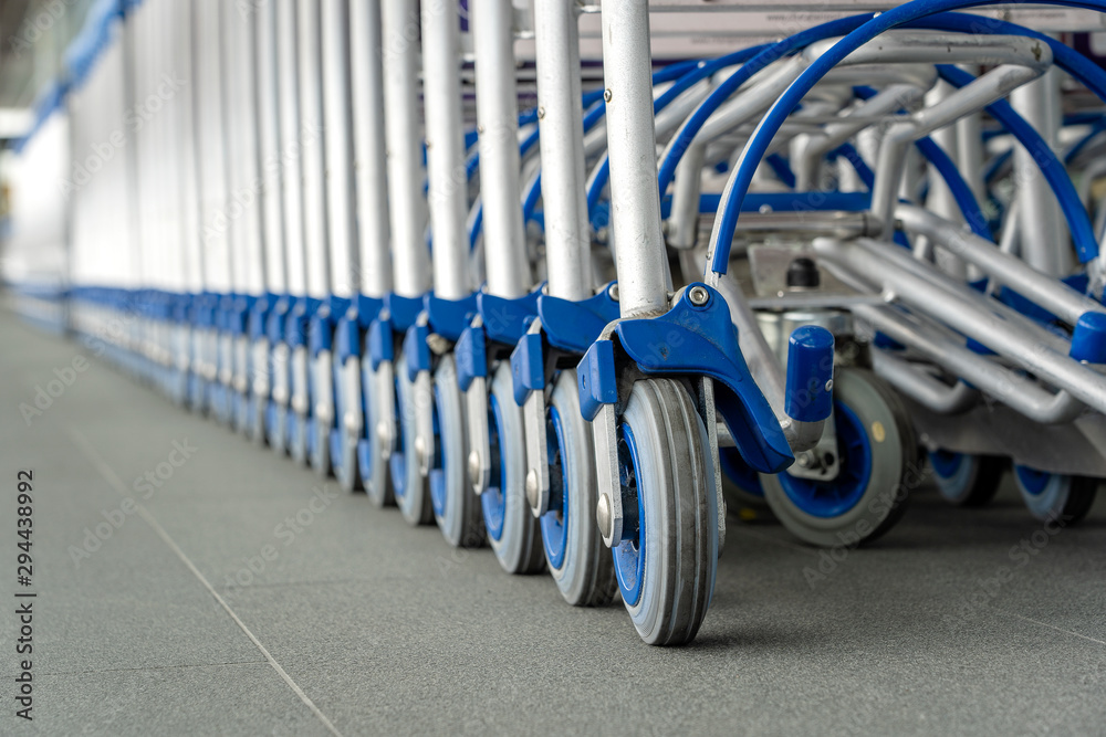 Trolleys luggage in a row in modern airport. Close up of luggage carts Trolleys luggage in a row in modern airport. Close up of luggage carts