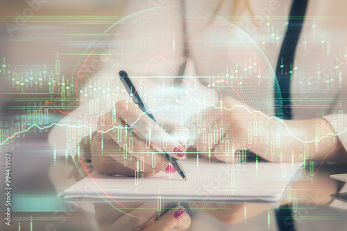 Wallpaper Mural Double exposure of hands making notes with forex chart huds. Stock market concept. Torontodigital.ca