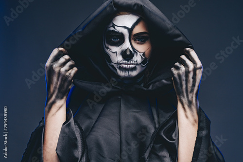 Female death in black hooded cape