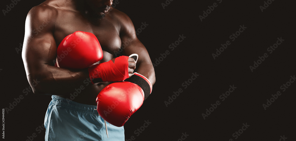 Cropped photo of boxer wearing red gloves