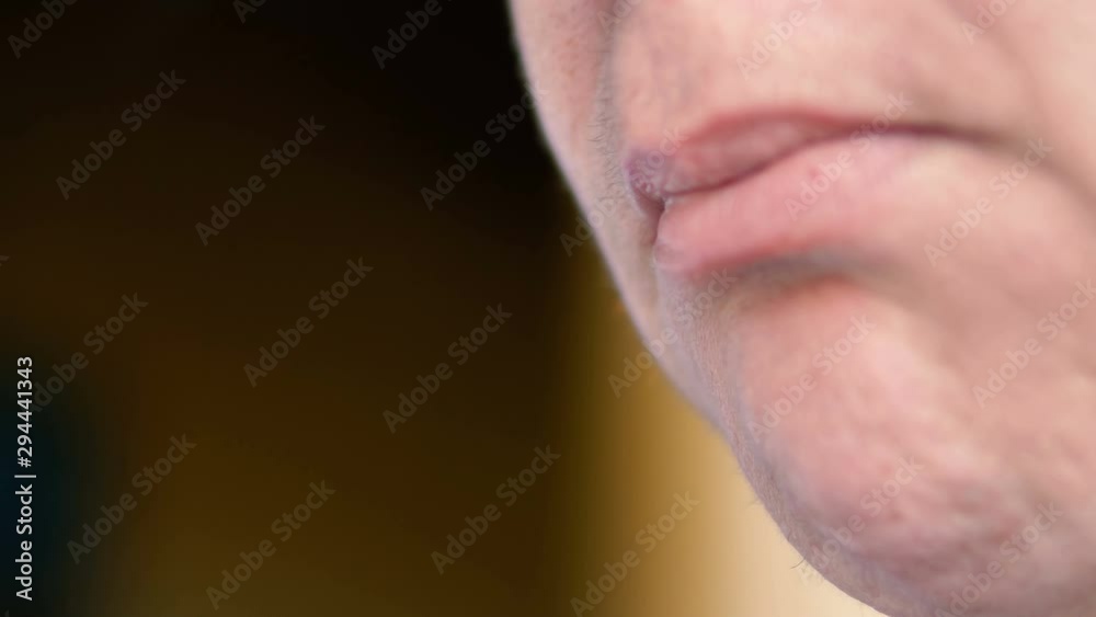 Close up of womans mouth smoking cigarrete