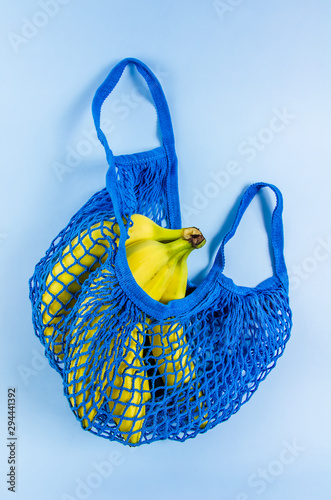 bananas in a blue bag. no plastic.