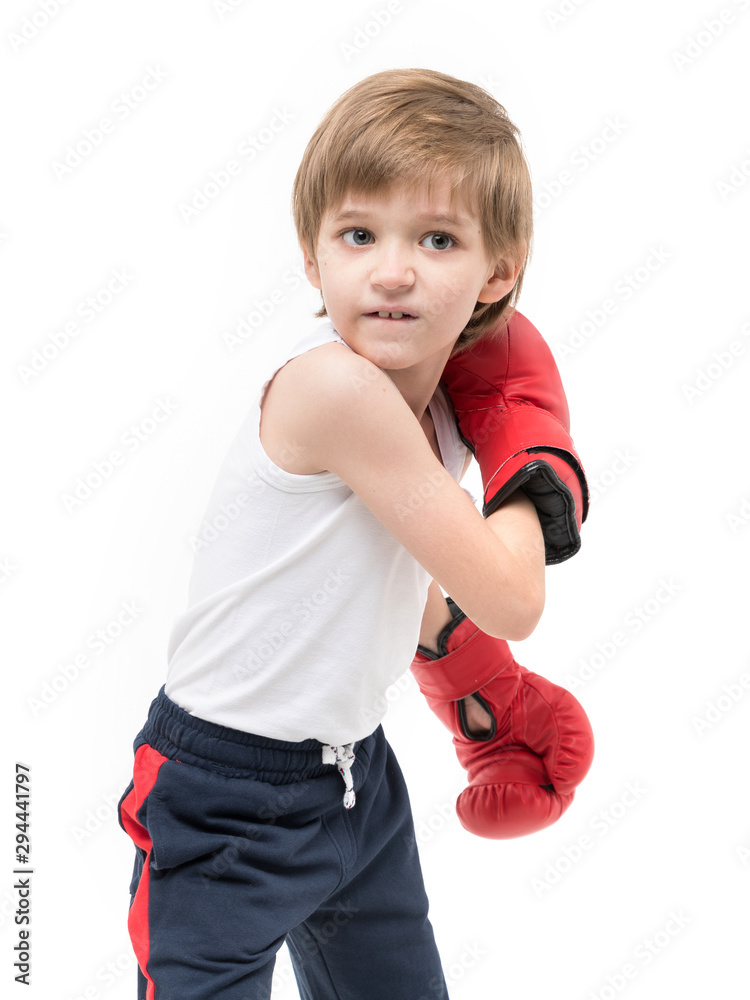 Sporty strong child boxing in red gloves and white t-shirt Sporty strong child boxing in red gloves and white t-shirt