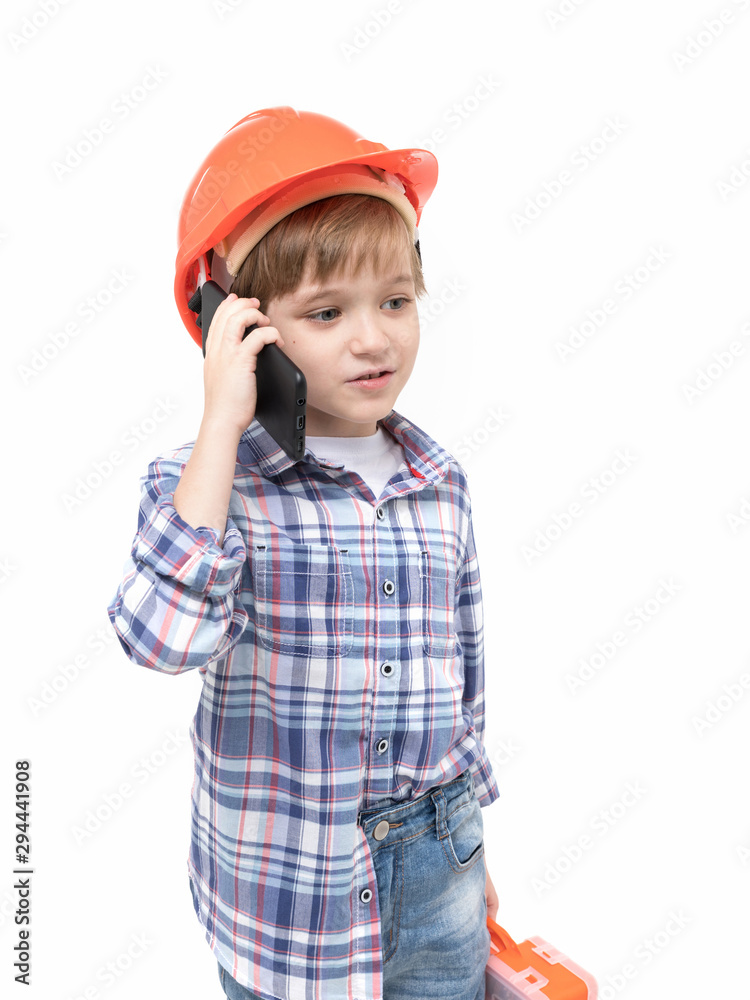 Adorable kid dressed as foreman in orange helmet and shirt Adorable kid dressed as foreman in orange helmet and shirt