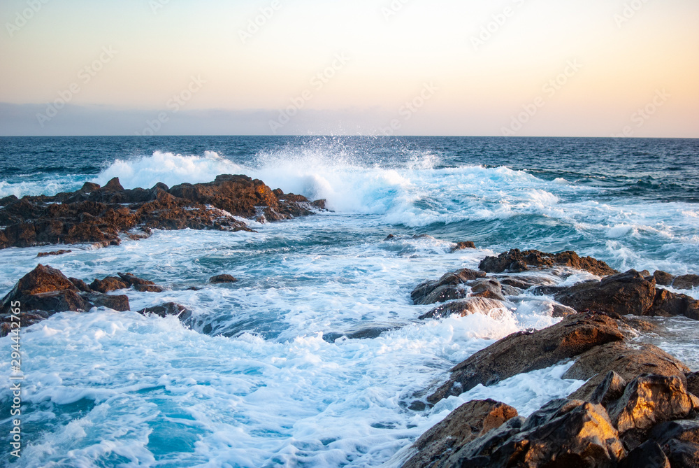 waves breaking on stone reef atlantic ocean