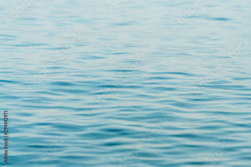 Ripples on surface of blue water background