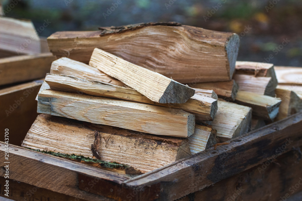 Firewood for burning in a furnace in a wooden box_