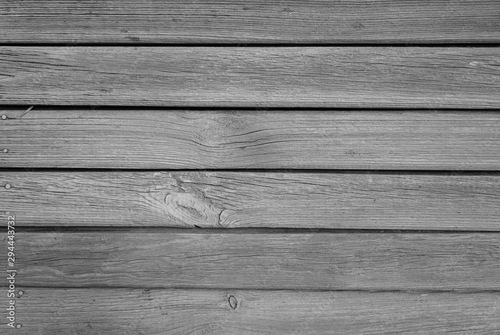 Old grungy wooden planks background in black and white. Old grungy wooden planks background in black and white.