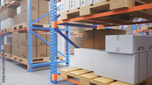 Fotografie Warehouse with cardboard boxes inside on pallets racks, logistic center